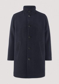 Donkerblauwe wollen jas met hoge kraag, sluiting met knopen aan de voorkant en twee schuin geplaatste zijzakken.