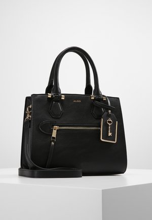 Black leather Aldo handbag with dual top handles, front zip pocket, detachable strap, and a decorative key tag on a white surface.