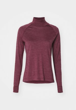 Burgundy long-sleeve turtleneck shirt with raglan sleeves and a soft texture. Features a rounded hem and fitted cuffs.