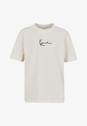 Crème-kleurig t-shirt met korte mouwen van katoen, met een zwart handtekeninglogo aan de voorkant en een ronde halslijn.
