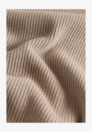 Beežikas soonikkangas pehme tekstuuriga, millel on vertikaalsed triibud ja nõtked niidi tiheduse variatsioonid, luues hubase ilme.