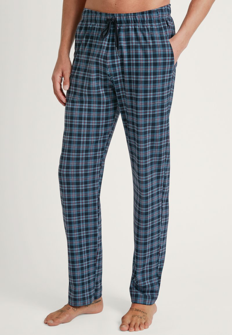 Blauwe en zwarte geruite pyjamabroek met een elastische tailleband en koord. Bevat zijzakken en heeft een ontspannen pasvorm. Gemaakt van katoen.