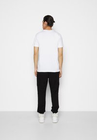 Ellesse INNES - Cargobukse - black