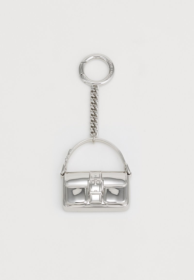 Silver keychain shaped like a handbag, featuring a structured design, shiny metallic surface, and a chain attachment.