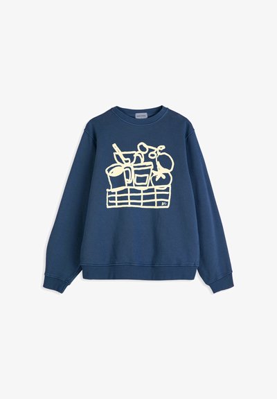 Sweat-shirt bleu marine avec un dessin en ligne blanche d'un panier contenant une tasse, un verre, des tomates et d'autres aliments sur le devant.