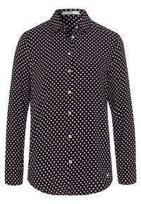 Svart skjorta med knappar, långa ärmar, mönstrad med vita prickar, standardkrage och rak nederkant. Slätt tyg.