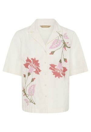 Kreemjas lühikeste varrukatega nööbitav särk, mille esiküljel on roosade ja punaste lillemotiividega tikkimine ning väike krae.