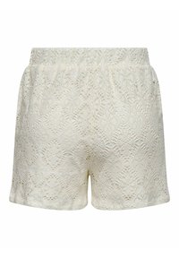 Kantenshorts in lichtbeige met een elastische tailleband. Heeft een ingewikkeld kantpatroon, een gladde textuur en een korte lengte. Geen zakken.