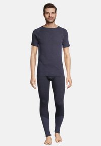 Mørkeblå termisk skjorte og leggings sæt lavet af struktureret stof, med korte ærmer, tætsiddende design og kontrasterende paneldetaljer.