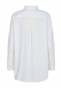 Camicia bianca a maniche lunghe con colletto, una pince lungo il centro della schiena e polsini con bottoni. Tessuto liscio con una vestibilità leggermente rilassata.
