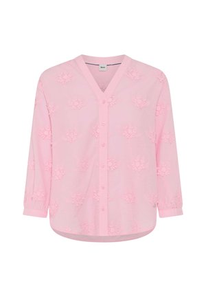 Light pink button-up blouse with 3D floral patterns and 3/4 sleeves, featuring a V-neck and rounded hem.
