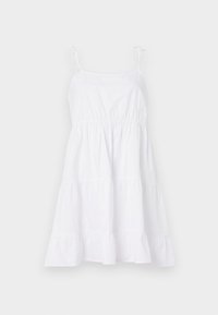 White cotton sundress with thin straps, a fitted bodice, and a tiered skirt. The fabric is smooth with a light, airy texture.