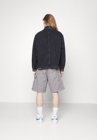 Carhartt WIP Giacca di jeans - black denim