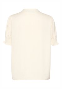 Top color crema con maniche corte e puffate. Presenta una vestibilità rilassata e dettagli arricciati alle estremità delle maniche. Texture morbida e design minimalista.