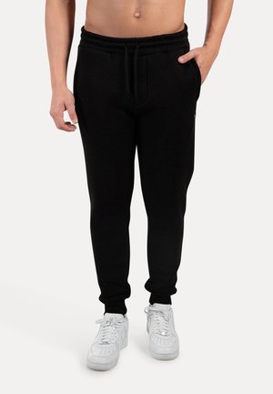 Pantaloni sportivi - schwarz