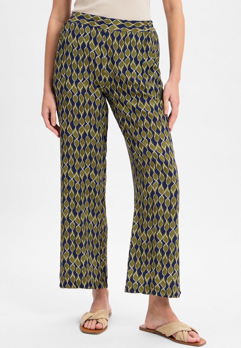 Weite Hosen aus gemustertem Stoff, in einer Rautenoptik mit Olivgrün, Marineblau und Cremefarben. Glatte Textur, elastischer Bund.