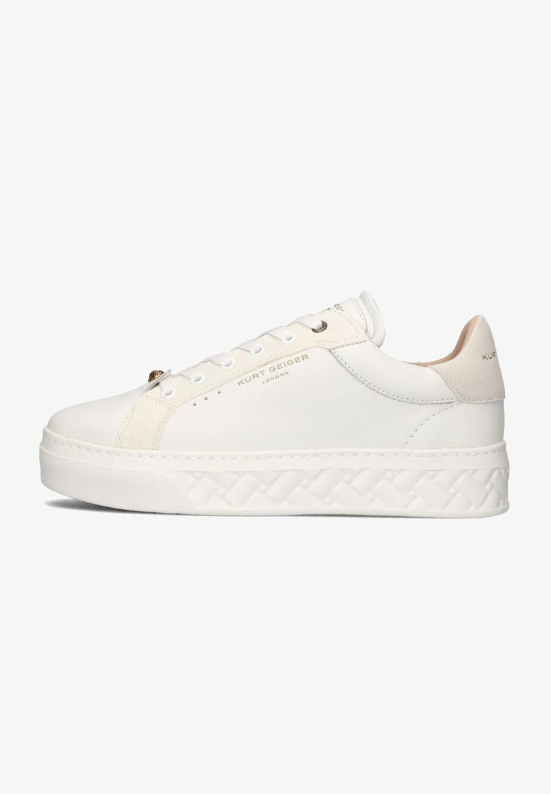 White leather sneaker with a textured platform sole, featuring subtle gold hardware and a light beige accent at the back. "Kurt Geiger" branding visible.