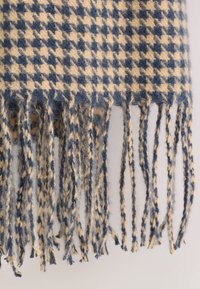 Wool scarf featuring a navy blue and cream houndstooth pattern, finished with twisted fringe edges for added texture.