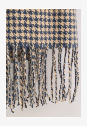 Wollen sjaal met een marineblauw en crèmekleurig pied-de-poule-patroon, afgewerkt met gedraaide franjes voor extra textuur.