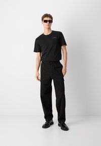 Calvin Klein Jeans REGULAR STRAIGHT  - Kapsáče - black