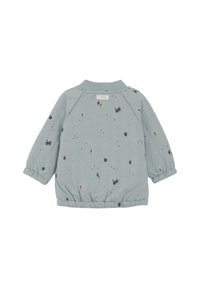 Ljusblå quiltad jacka med elastiska ärmslut och fåll, med ett spritt lövmönster i olika färger och en fast krage.