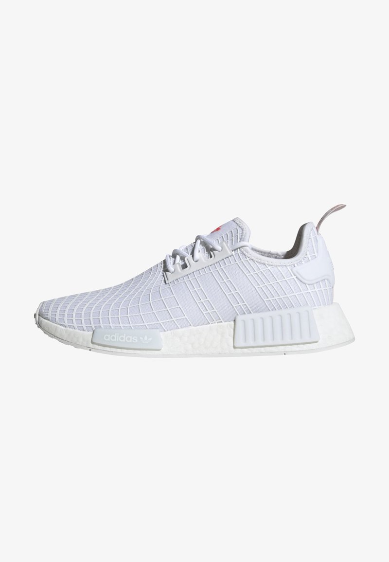 White athletic shoe with a textured mesh upper, featuring a grid pattern, three stripes, and a cushioned sole with a prominent heel accent.