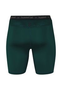 Shorts de sport verts en tissu extensible avec une taille élastique noire arborant le logo "hummel" et un design texturé.