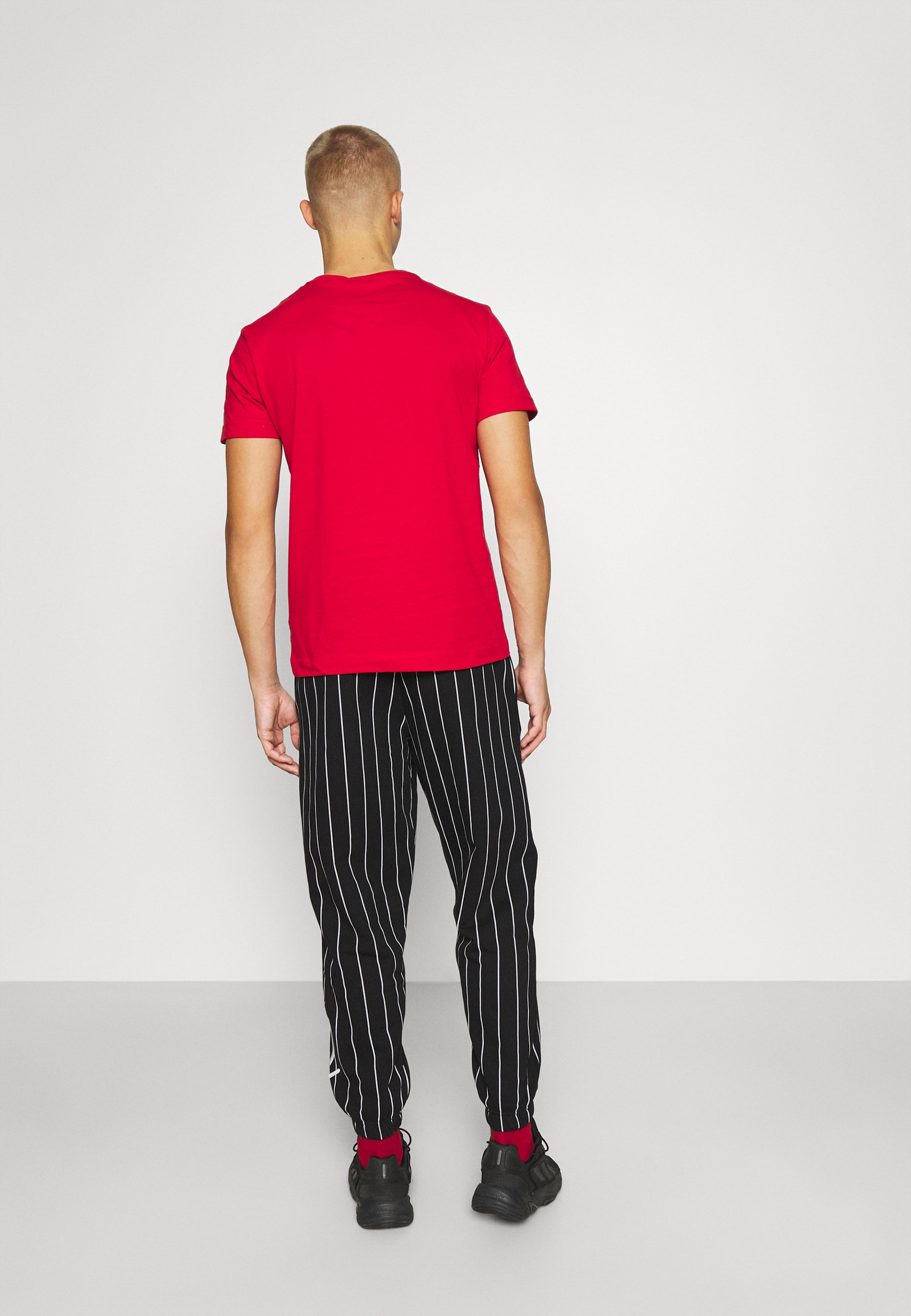 red pinstripe pants