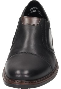 Black leather slip-on shoe with a smooth texture, rounded toe, stitched detailing, and a contrasting brown accent at the heel.