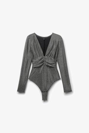 Shiny gray long-sleeve bodysuit with a deep V-neck, twisted front detail, and snap closure at the bottom. Soft, textured fabric.