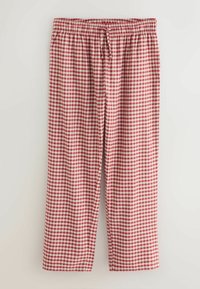 Červené a biele kárované pyžamové nohavice s elastickým opaskom a šnúrkou. Vyrobené z mäkkej tkaniny, s voľným strihom a rovnými nohavicami.