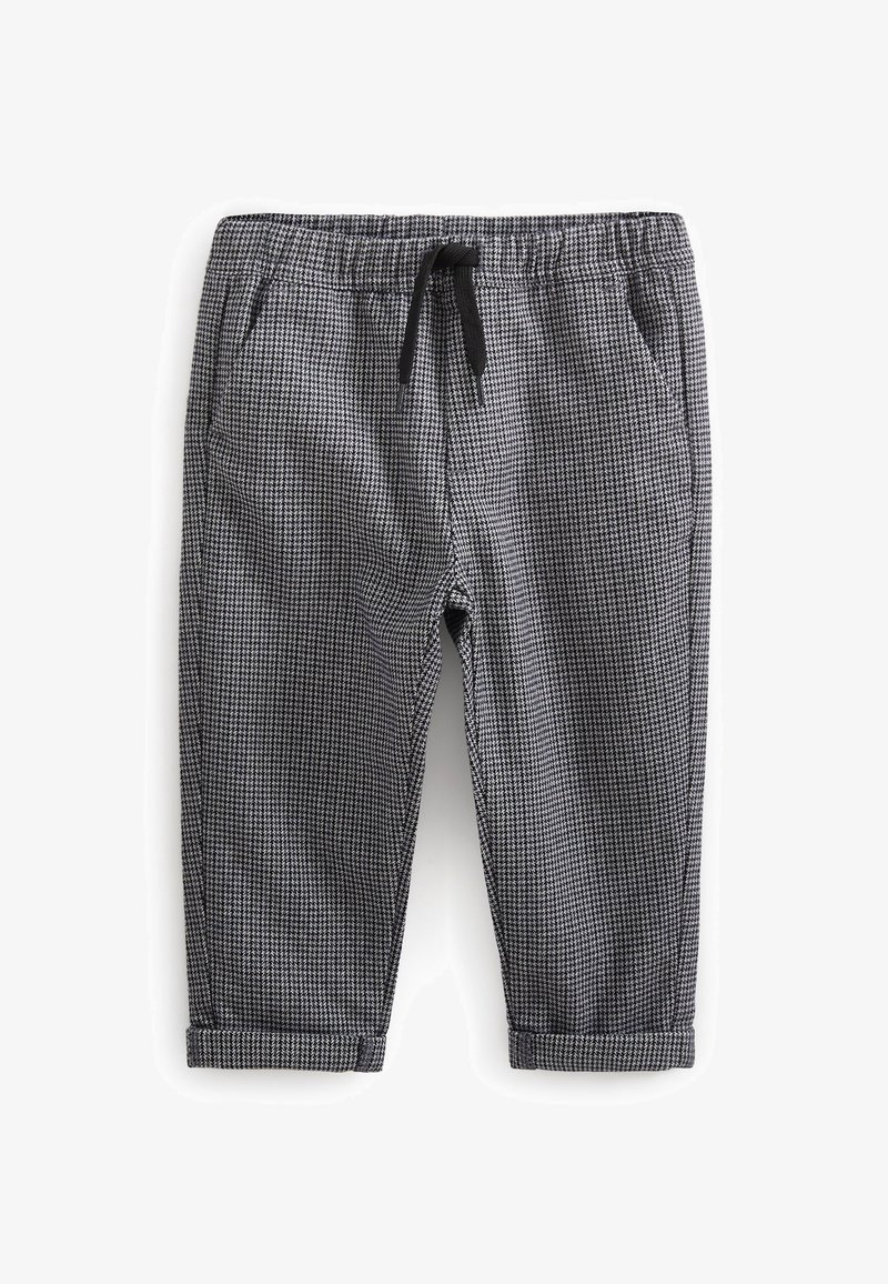 Pantalon à motifs pied-de-poule noir et blanc taille tout-petit, avec taille élastique, cordon de serrage noir, poches latérales et ourlets retroussés.