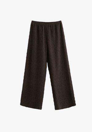 Sorte, teksturerede bukser med vide ben og elastik i taljen, lavet af letvægtsstof, vist fladt på en hvid baggrund.