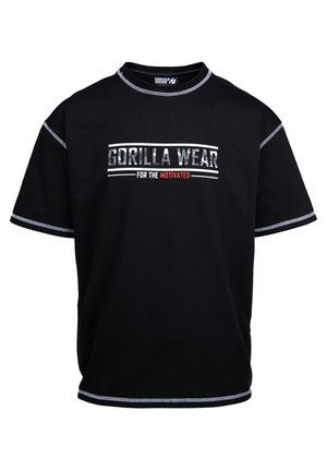 Zwarte T-shirt met korte mouwen, voorzien van contrasterende witte stiksels en een frontafdruk met de tekst "GORILLA WEAR FOR THE MOTIVATED." Gemaakt van katoen.