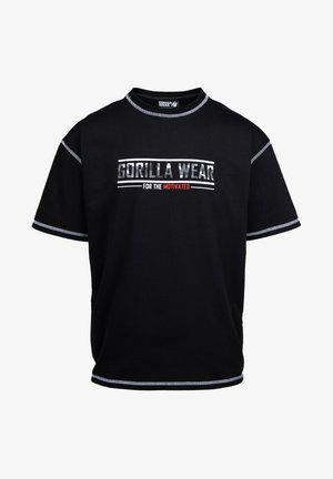 Melns īsām piedurknēm T-krekls ar kontrastējošu baltu šuvi un priekšējo grafiku ar uzrakstu "GORILLA WEAR FOR THE MOTIVATED". Izgatavots no kokvilnas.