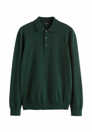 Tume roheline, pikkade varrukatega polo särk, mis on valmistatud pehmest kangast. Omab klassikalist kraed ja kolme nupuga kaelust. Lihtne, ühesooline disain.