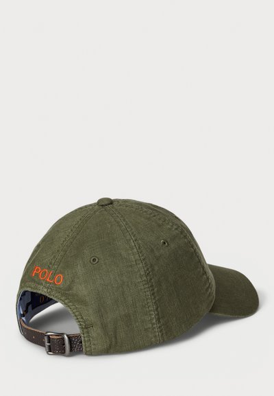 Green cotton baseball cap with a curved brim, featuring orange "POLO" embroidery on the back, and a brown adjustable strap.