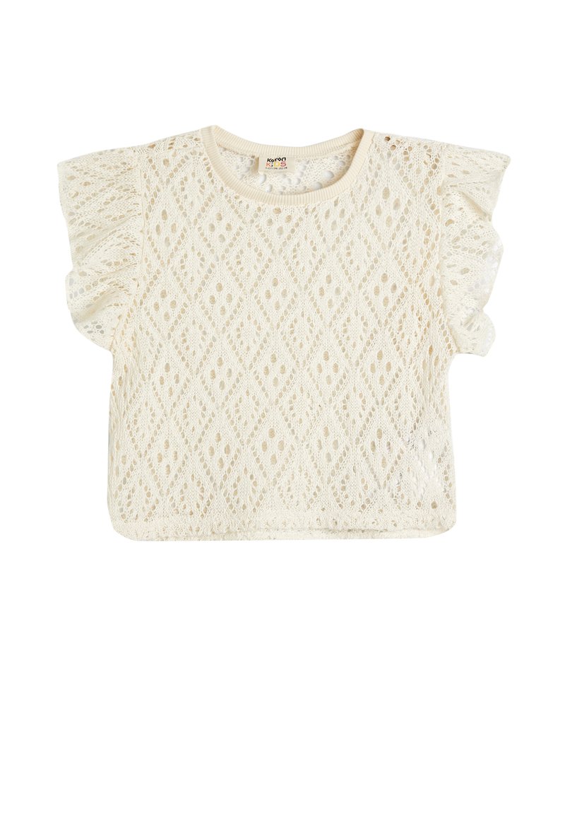 Top bianco in pizzo a maniche corte con un motivo a rombi, caratterizzato da maniche arricciate e scollatura tonda. Design leggero e testurizzato.