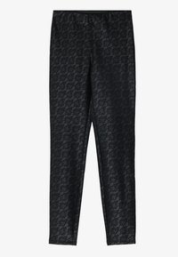 Zwarte legging met een bloemenkantpatroon, gemaakt van een rekbaar materiaal, met een elastische tailleband voor comfort en pasvorm.