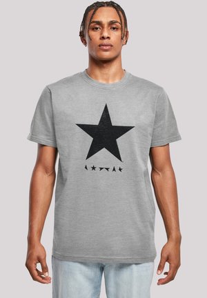 Gray cotton t-shirt featuring a large black star graphic on the front, with smaller stars below, and a round neckline.