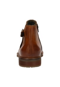 Bruine leren enkelboot met een gladde afwerking, een ritssluiting en een gestructureerde zool met horizontale groeven.