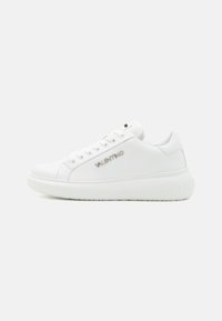 White leather sneaker with a smooth texture, rounded toe, flat laces, metal eyelets, and subtle branding on the side and heel.