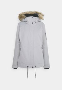 Veste d'hiver gris clair avec capuche bordée de fourrure, fermeture éclair frontale recouverte de boutons-pression, poches latérales zippées et cordons de serrage réglables à l'ourlet.