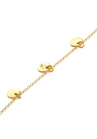 Bracelet en or avec des maillons ronds et de petites accents ronds, au fini poli et avec un motif gravé subtil.