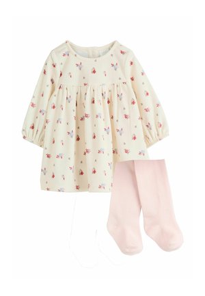 Cremefarbenes Baby-Kleid mit langen Ärmeln und kleinem rot-blauem Blumenmuster, kombiniert mit schlichten hellrosa Strumpfhosen.