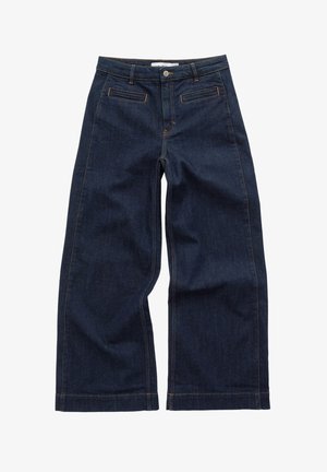 Weite, dunkelblaue Jeans mit mittlerer Taillenhöhe, kontrastierenden orangen Nähten, vorderen Taschen und einer glatten Textur.