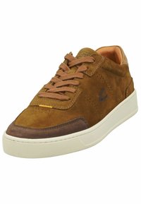 Brown suede sneakers with light brown lace details, a contrasting grey toe cap, and a white rubber sole. Perforated accents on the sides.