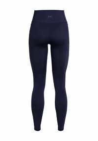Marina höga leggings i elastisk tyg med en mjuk textur. Har en tight passform och en subtil logga vid midjan.