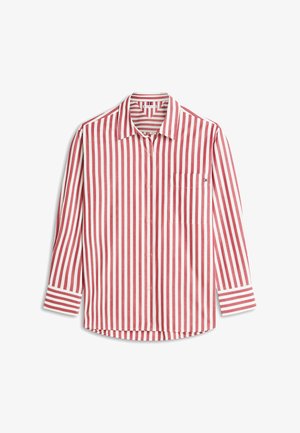 Chemise à manches longues rayée rouge et blanche avec col, dotée d'une poche poitrine et de poignets rayés contrastants. Confectionnée en tissu léger.