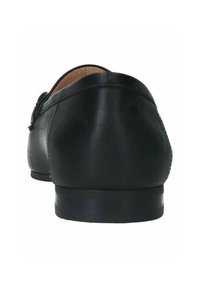 Black leather shoe featuring a sleek design, smooth texture, rounded shape, and a low, solid heel. Back view highlighting stitching detail.